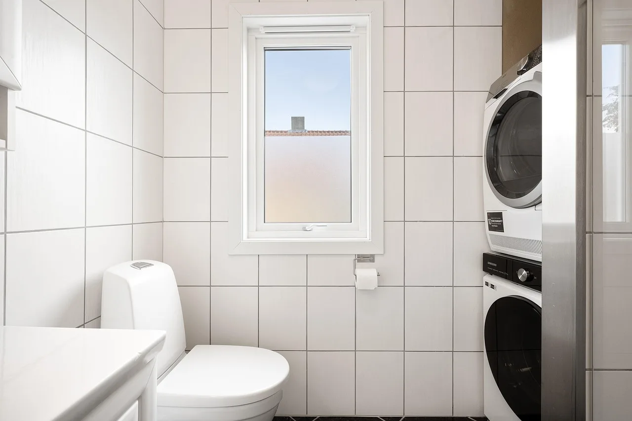 bathroom, toilet, washing machine, building, interior, house, design, architecture, real state, property. Laundromat Washer Water Pressure Problems: Causes and Fixes